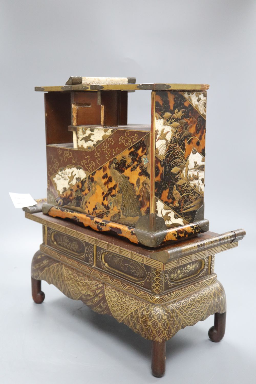 A Japanese Meiji lacquer table cabinet and similar stand, overall height 37.5cm